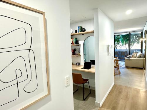 a living room with a drawing on the wall at Luxe Modern Randwick Abode with elevator in Sydney