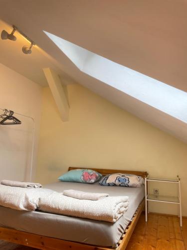 a bed in a room with a loft at U6 Schöpfwerk Home 7 in Vienna