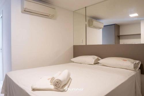 Ένα ή περισσότερα κρεβάτια σε δωμάτιο στο Solar Tambaú Flat Luxo