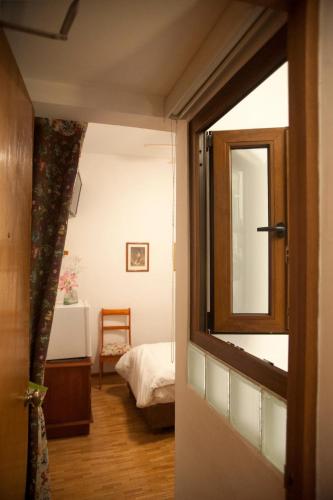 a door leading into a room with a bedroom at Chalet del Carmen, Coyoacán in Mexico City