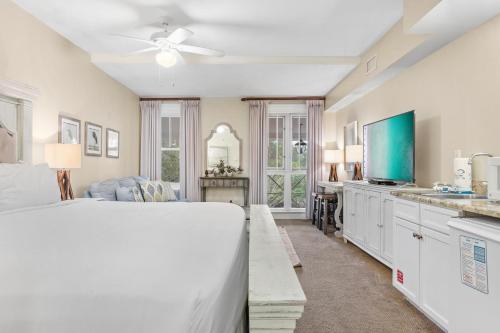 a bedroom with a bed and a living room at Grand Sandestin 2210 in Destin