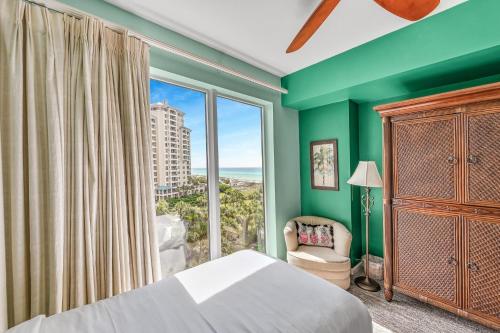 a bedroom with a bed and a large window at Westwinds 4740 in Destin
