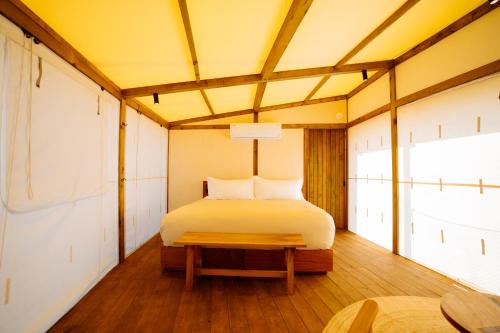 a bedroom with a bed in a room at Viatura Hacienda Xtojil, Yucatan, Merida, with Optional All Inclusive in Sotuta de Peón