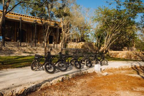 a row of bikes parked next to a building at Viatura Hacienda Xtojil, Yucatan, Merida, All Inclusive 