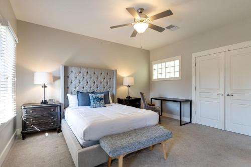 a bedroom with a bed and a ceiling fan at The Celebrity - Minutes to Broadway with a Balcony in Nashville