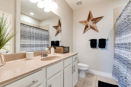 a bathroom with a sink and a toilet at The Celebrity - Minutes to Broadway with a Balcony in Nashville