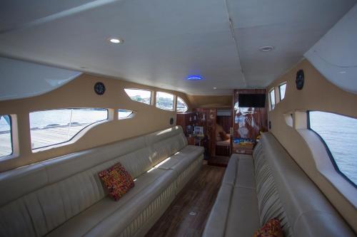 a view of the back of a boat with seats at Queen Ruizi Private Yacht in Pesanggaran