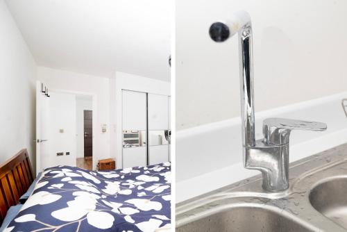 a kitchen sink and a bathroom with a bed at Stylish 1BR Flat with Balcony Near Tube and Shops in Woolwich