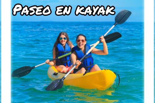 two people in a kayak in the water at Tequila SunBeach Baru Eco-Hotel in Baru