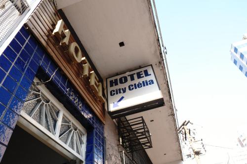 a hotel sign on the side of a building at Hotel city Clélia in Sao Paulo