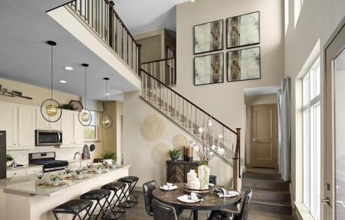 a kitchen and dining room with a table and chairs at Orleans Street - Aurora in Aurora