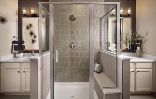 a shower with a glass door in a bathroom at Orleans Street - Aurora in Aurora