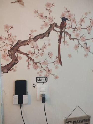 a wall with a tree and a sign on it at Departamento en el centro Histórico CDMX Bolivar 8 Edificio SANTA CLARA in Mexico City