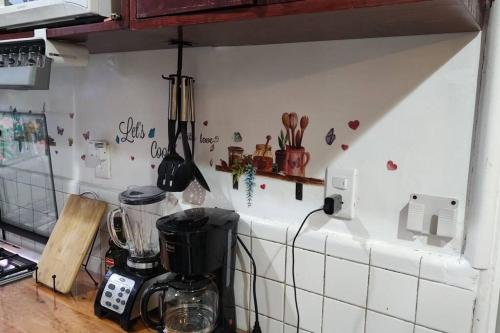 a kitchen with a counter top with a blender at Departamento en el centro Histórico CDMX. in Mexico City