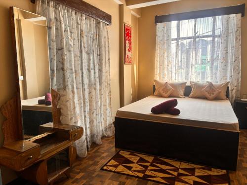 Postel nebo postele na pokoji v ubytování Sai Darshan Homestay