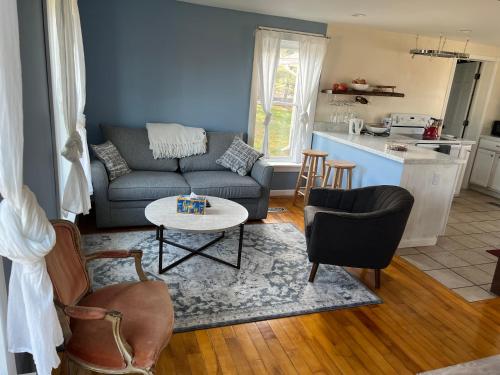 a living room with a couch and a table at Country House in Catskills in Saugerties