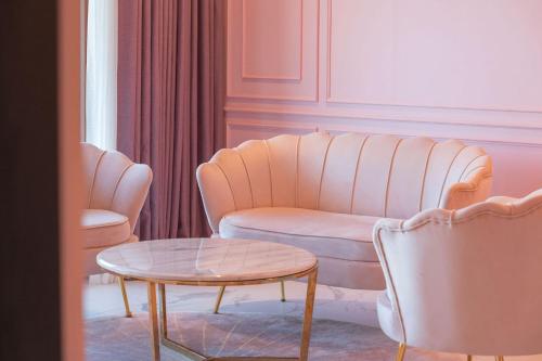 a living room with a couch and a table at Dignity Hotel in Yangyang