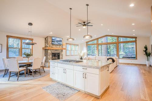 a kitchen and dining room with a table and chairs at Wooded Bliss in Carnelian Bay