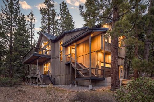 a house in the woods with a tree at Tahoe Tranquili-Tree in Kings Beach