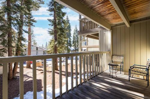 a balcony of a house with a bench on it at The Kingswood Retreat in Kings Beach