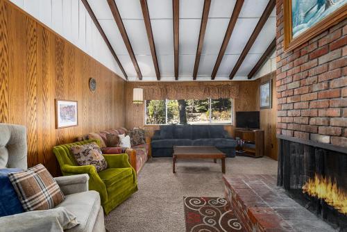 a living room with a couch and a fireplace at Agate Bay Ranch in Carnelian Bay