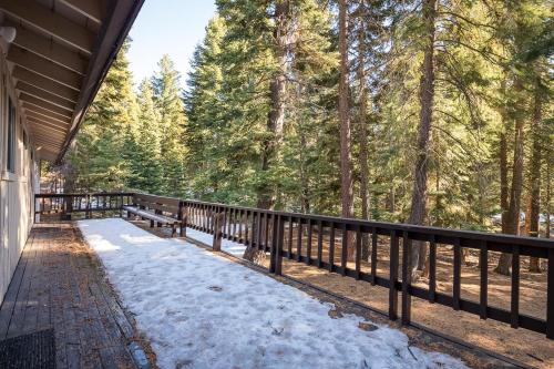 a porch of a house with snow on the ground at Agate Bay Ranch in Carnelian Bay
