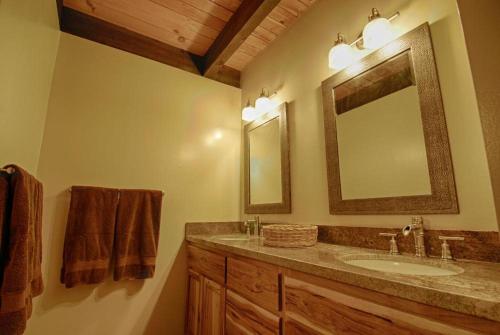 a bathroom with a sink and a mirror at Bed-N-Bliss in Kings Beach