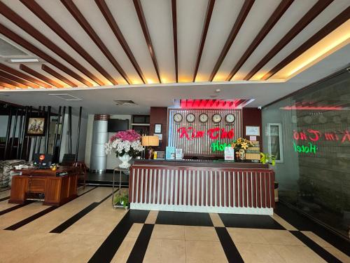 a lobby of a restaurant with a reception counter at Kim Tho Hotel in Can Tho