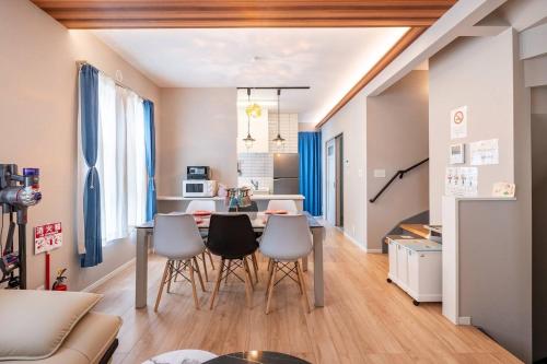 a kitchen and living room with a table and chairs at 鎌倉.花月.HOME in Kamakura