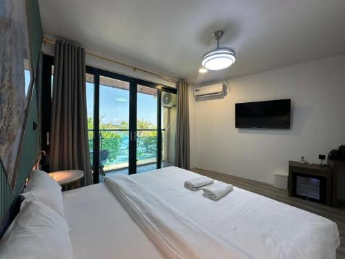 Cama o camas de una habitación en Bibee Maldives