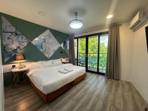 Cama o camas de una habitación en Bibee Maldives