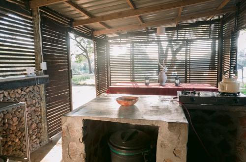 a kitchen with a counter top and a stove at Limpokwena Nature Reserve in Tokio