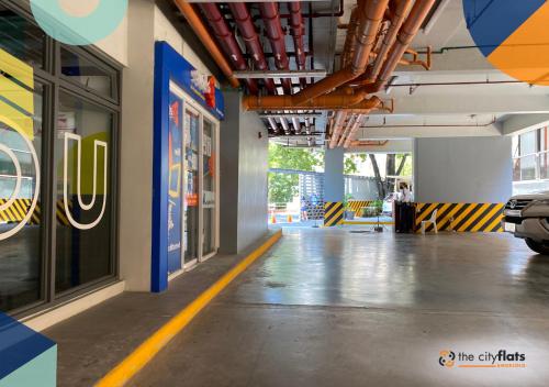 a hallway of a building with a parking lot at The City Flats Amorsolo in Manila