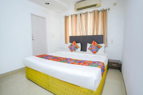Katil atau katil-katil dalam bilik di FabExpress Nimalan Residency