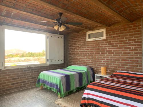 Una cama o camas en una habitación de Baja69 lodge