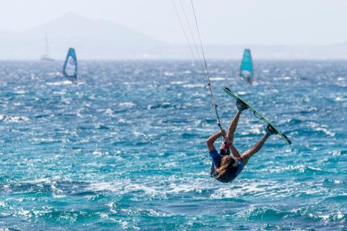 a person on a board in the water at Harmony Luxury Villas Naxos in Naxos Chora