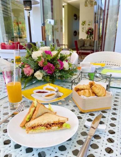 a table with a sandwich and a box of bread at Binh An Village Resort in Da Lat