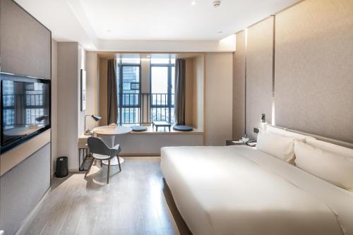 Postel nebo postele na pokoji v ubytování Atour Hotel Qingyuan Shunying Guangbai