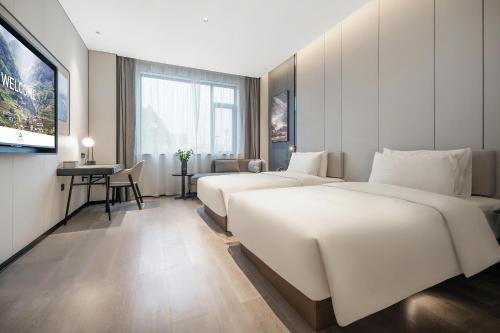 Postel nebo postele na pokoji v ubytování Atour Hotel Chengdu Jinhua Wanda Liulichang