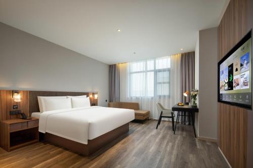 Katil atau katil-katil dalam bilik di Atour X Hotel Hangzhou Binjiang Torch Avenue