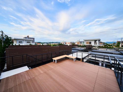 a bench sitting on top of a roof at Rakuten STAY VILLA Awaji in Minamiawaji