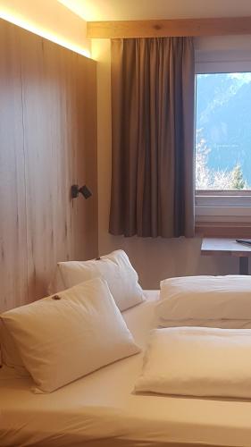 Un ou plusieurs lits dans un hébergement de l'établissement Aparthotel Hohe Brücke