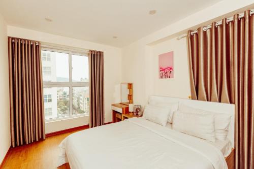 En eller flere senge i et værelse på Căn hộ 3 phòng ngủ cao cấp view biển