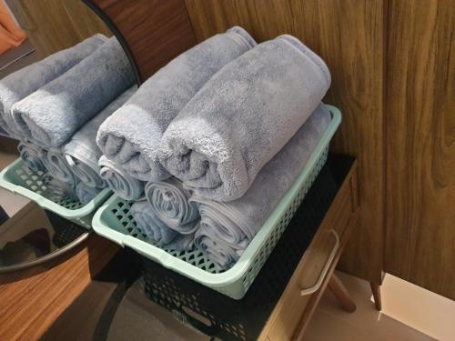 a basket filled with towels and towels at Urban Oasis Retreat in Melaka