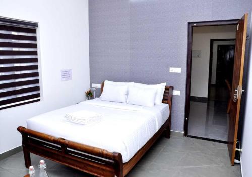 Postel nebo postele na pokoji v ubytování Whiteway Homestay
