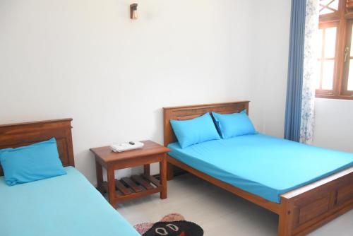 Postel nebo postele na pokoji v ubytování Silverline Guest House Anuradhapura