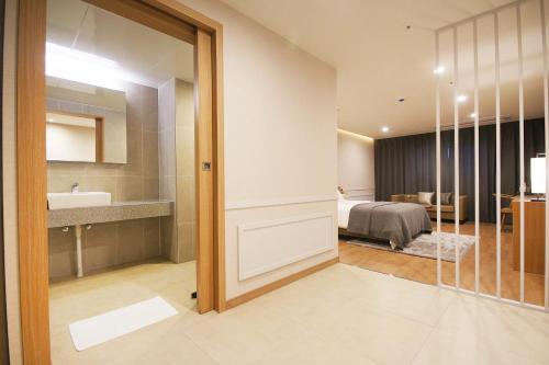 Ένα ή περισσότερα κρεβάτια σε δωμάτιο στο Maruo Hotel
