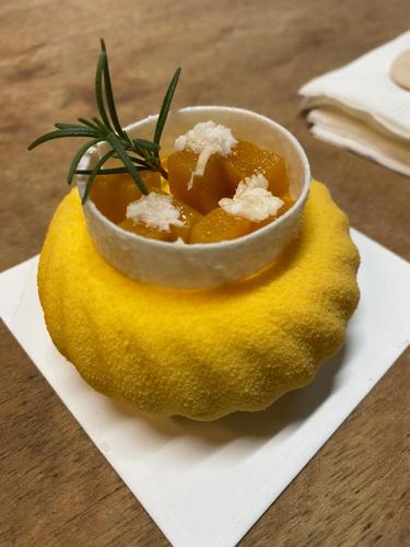 a bowl of food on top of a piece of fruit at Hương Giang Hotel & Coffee in Thái Bình