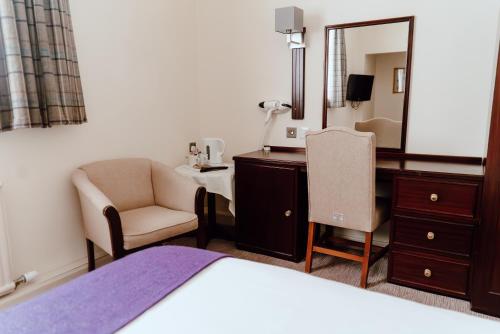 Postel nebo postele na pokoji v ubytování Caladh Inn