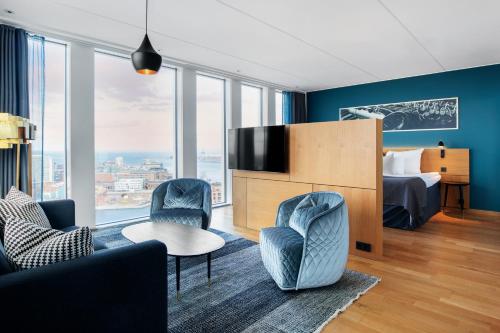 a hotel room with a bed and a tv at Clarion Hotel Malmö Live in Malmö